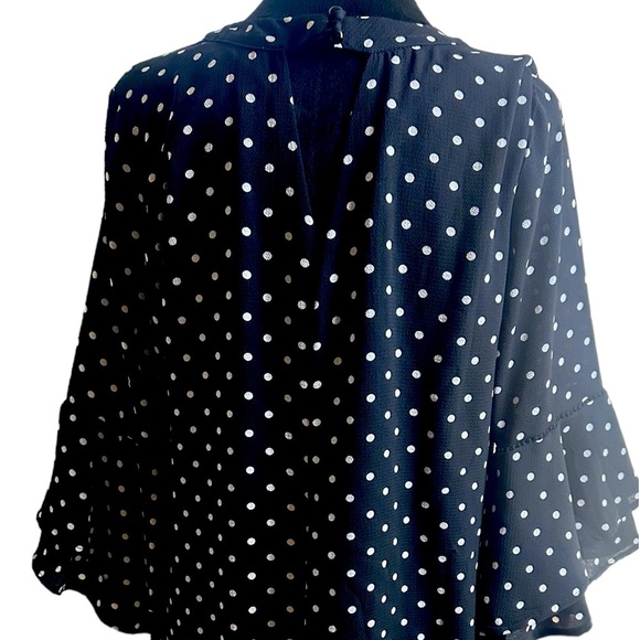 Brand: NAIF, black dress, with white dots, and flared sleeves - Picture 2 of 12